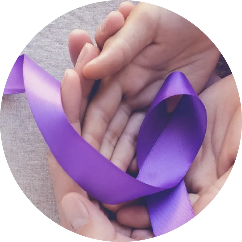 Hands gently holding a purple epilepsy awareness ribbon symbolising support and solidarity