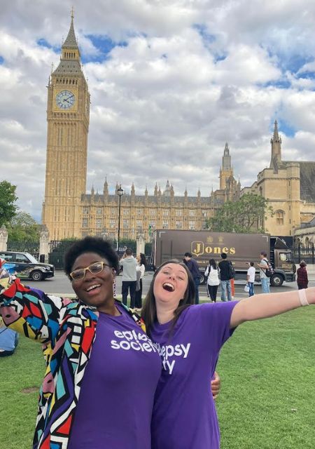 Jo and family member wearing purple Epilepsy Society t-shirts at Big Ben Westminster supporting epilepsy awareness