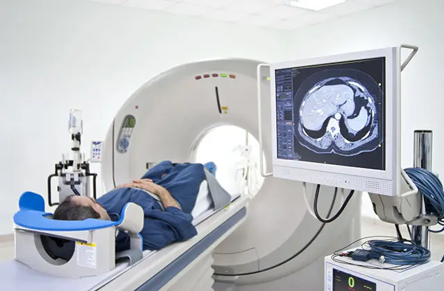 Patient undergoing MRI scan for epilepsy diagnosis with medical staff