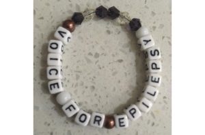 Beaded bracelet spelling Voice For Epilepsy with letter beads