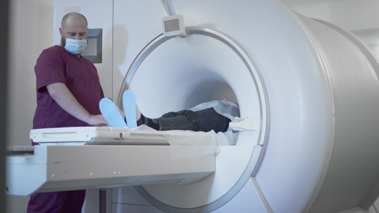Patient undergoing PET scan or MRI brain imaging test for epilepsy diagnosis in modern medical clinic