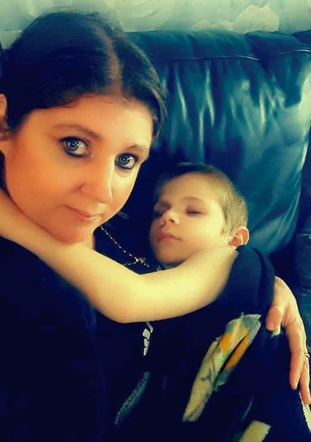 Mother holding young son Toby Hutchinson sharing their family epilepsy journey and support experience