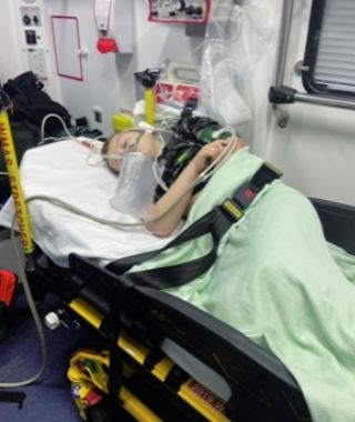 Young Harry being transported in ambulance following epilepsy seizure, showing the reality of emergency care