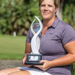 Jane Turner, Voice For Epilepsy patron and professional golfer, holding trophy after tournament win
