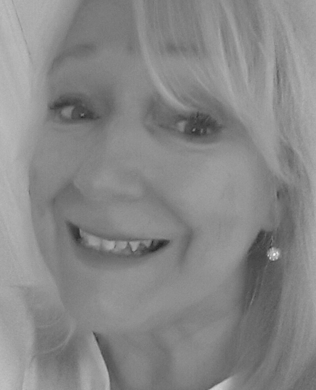 Julie Clark smiling portrait photo mother sharing her family epilepsy journey story