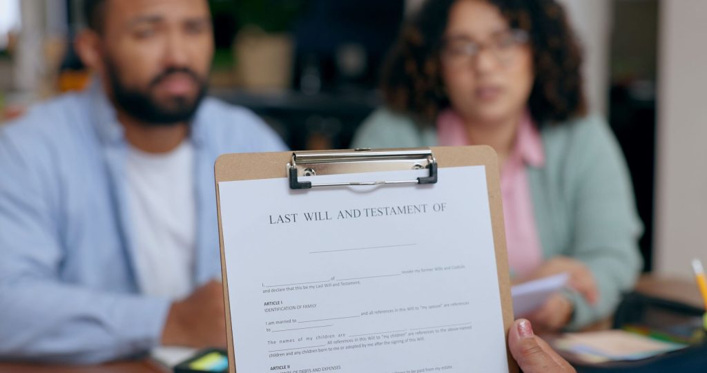 Person reviewing last will and testament document for estate planning and epilepsy legacy giving