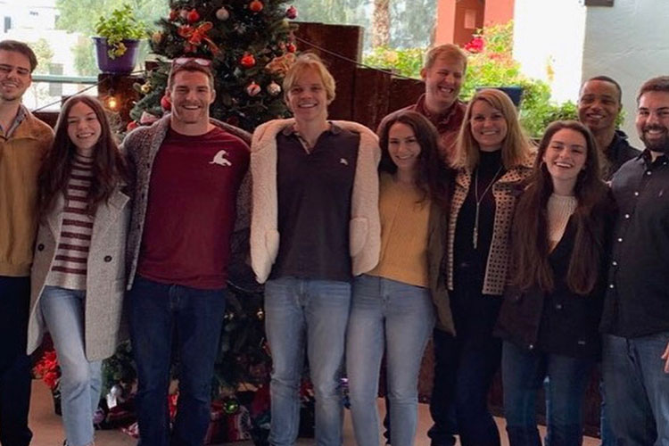 Addison Taylor with family and friends at holiday gathering, celebrating life whilst living with epilepsy