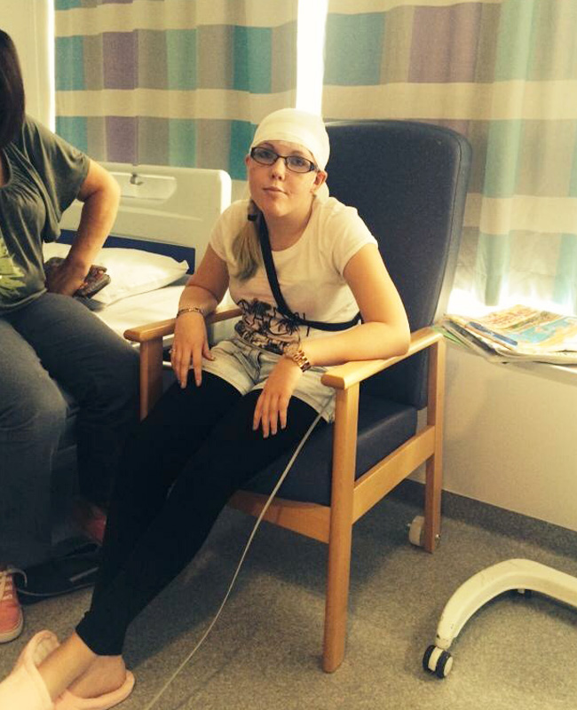 Tracey Perry in hospital wearing head bandage during epilepsy treatment sharing her carer experience story