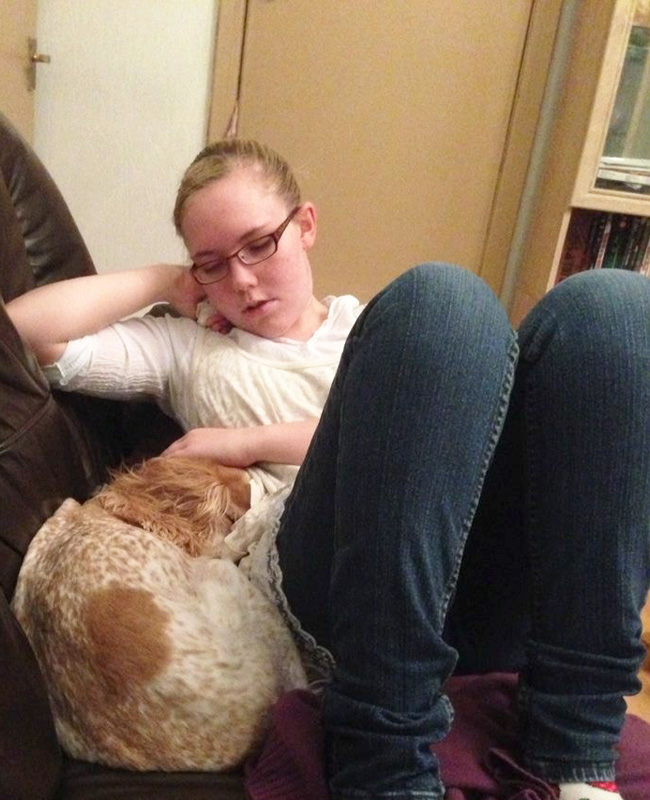 Tracey Perry relaxing at home with her ginger cat sharing everyday life with epilepsy